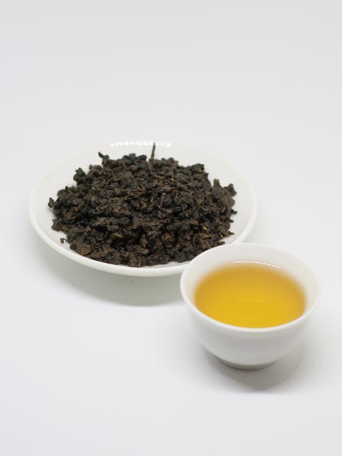Laço orgânico Guan Yin do chá de Oolong da mola com as folhas de chá verdes aplainadas